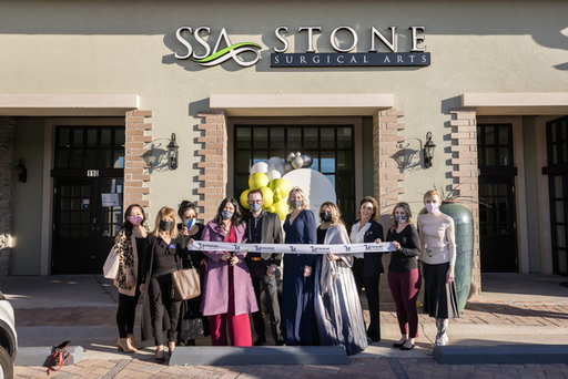 Dr. Mona Stone cuts the ribbon